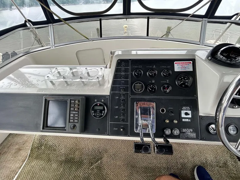 Slide: The Image of Control panel of a 1995 Carver 370 Aft Cabin boat, featuring navigation instruments. - 16