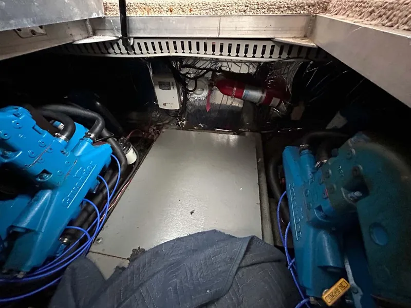 Slide: The Image of Engine room of 1995 Carver 370 Aft Cabin with blue engines and equipment. - 25