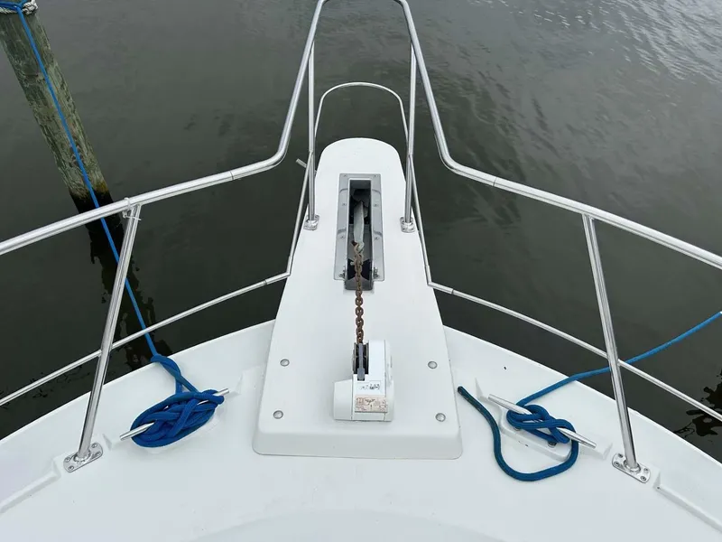 Slide: The Image of Bow view of 1995 Carver 370 Aft Cabin with anchor and blue ropes. - 28