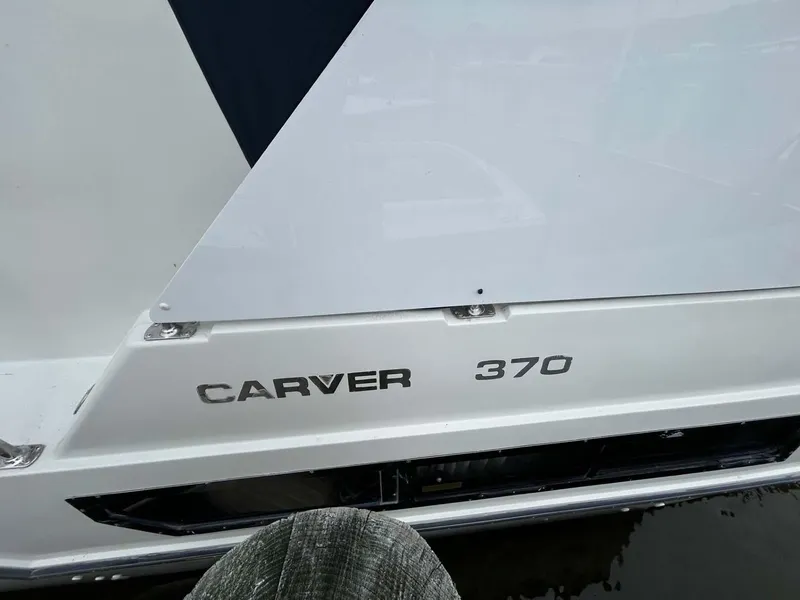 Slide: The Image of 1995 Carver 370 Aft Cabin boat, white exterior with model name visible. - 33