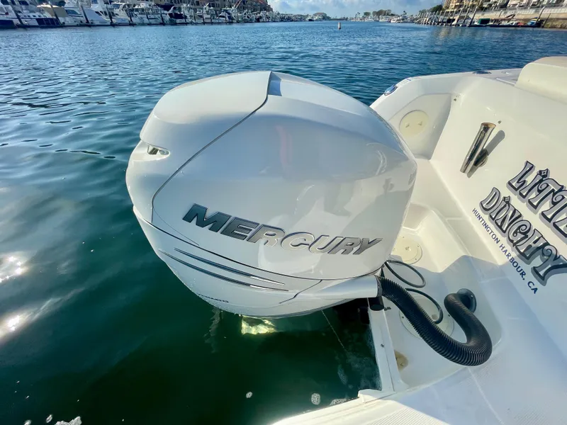 Slide: The Image of 2018 Boston Whaler 230 Vantage with Mercury outboard engine on calm water. - 20