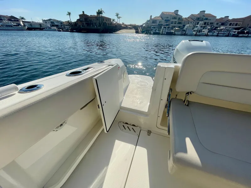 Slide: The Image of 2018 Boston Whaler 230 Vantage boat interior with waterfront view. - 24