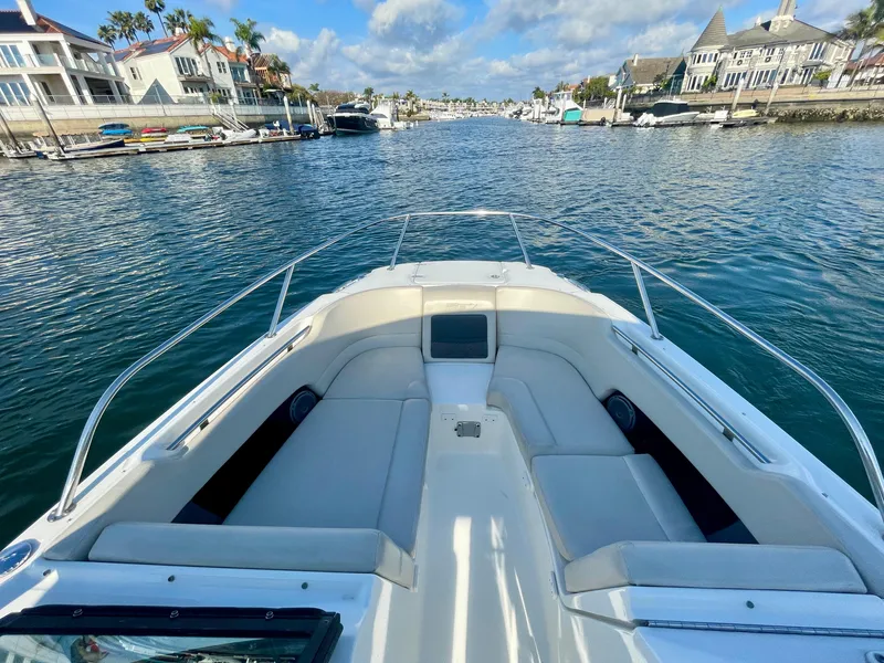 Slide: The Image of 2018 Boston Whaler 230 Vantage boat on a scenic waterway. - 26