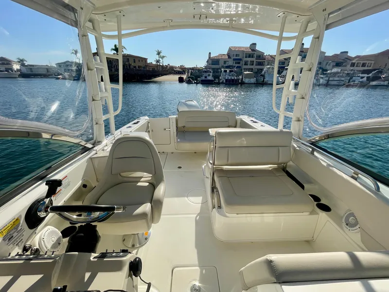 Slide: The Image of 2018 Boston Whaler 230 Vantage boat interior with waterfront view. - 29