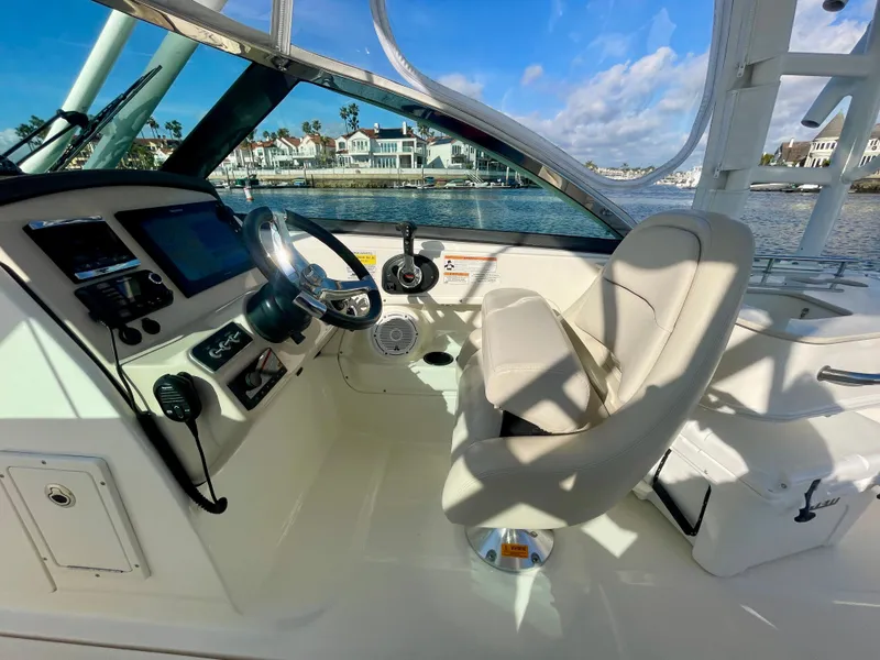Slide: The Image of 2018 Boston Whaler 230 Vantage boat interior with steering wheel and control panel. - 34