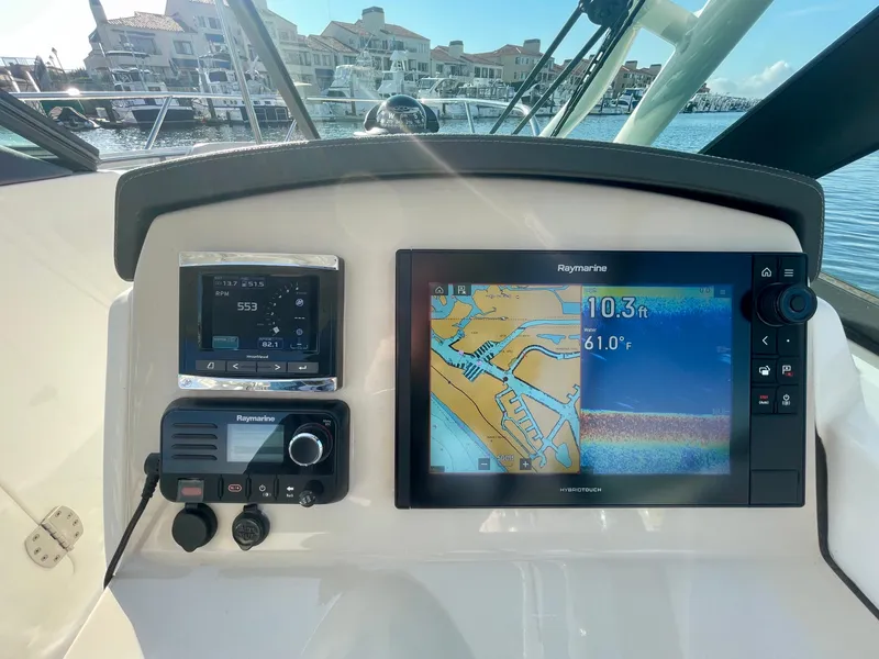 Slide: The Image of Boston Whaler 230 Vantage 2018 dashboard with navigation and communication systems. - 37
