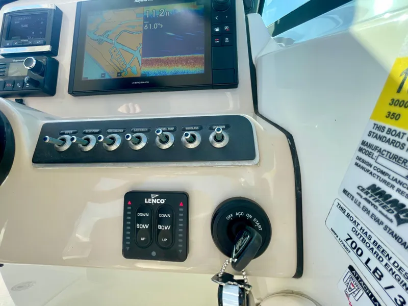 Slide: The Image of Control panel of a 2018 Boston Whaler 230 Vantage boat with navigation display. - 38