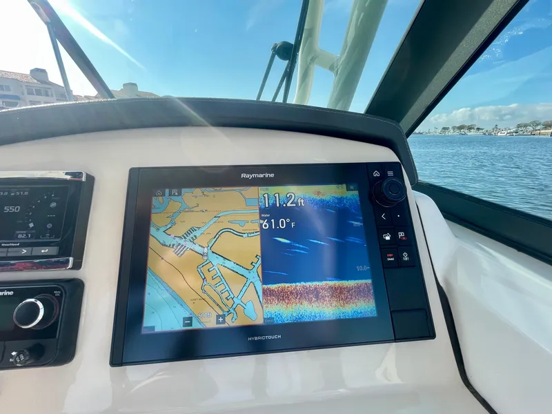 Slide: The Image of Dashboard of 2018 Boston Whaler 230 Vantage with navigation display. - 39