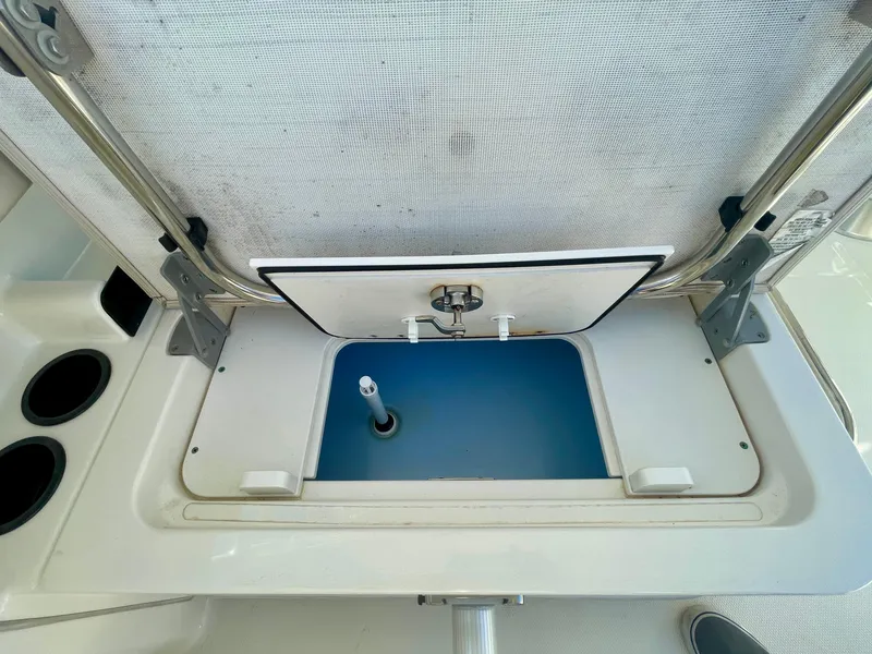 Slide: The Image of 2018 Boston Whaler 230 Vantage boat storage compartment open, showcasing interior features. - 43