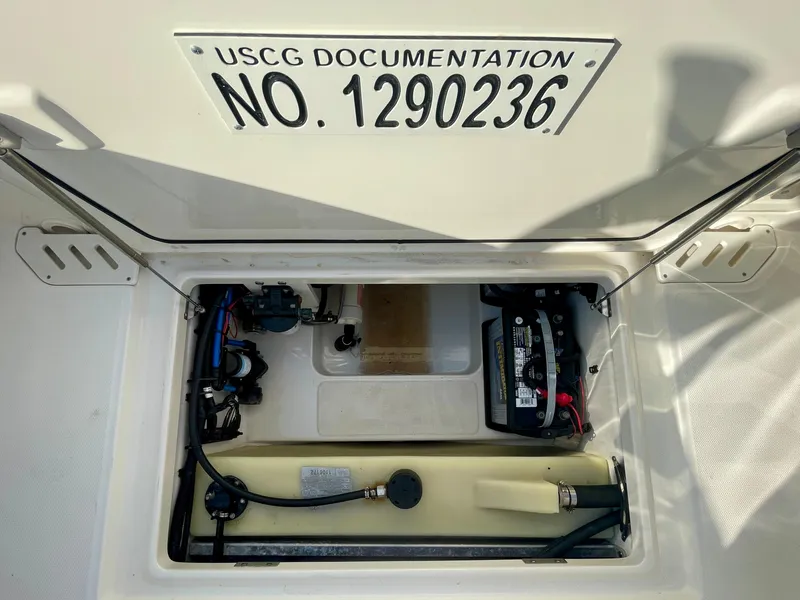 Slide: The Image of 2018 Boston Whaler 230 Vantage boat compartment with USCG documentation number. - 47