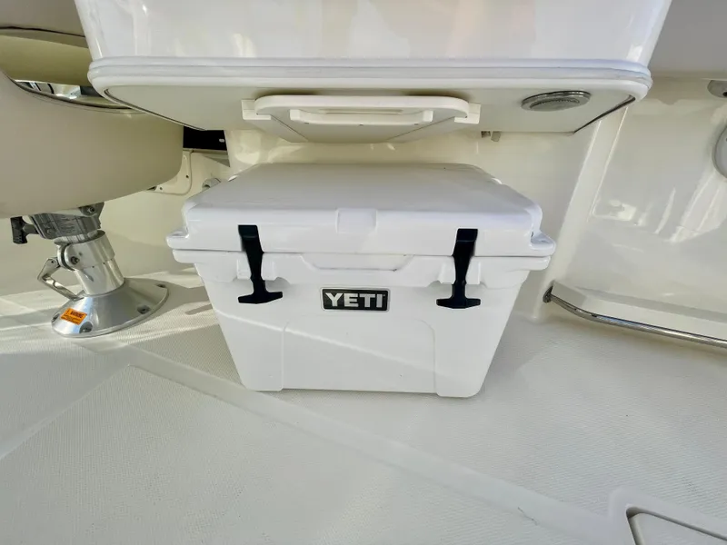 Slide: The Image of YETI cooler on 2018 Boston Whaler 230 Vantage boat deck. - 49