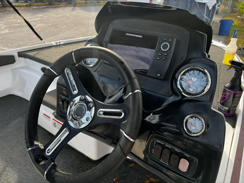 Slide: The Image of Steering wheel and dashboard of a 2019 Nitro Z17 boat with gauges and electronics. - 4