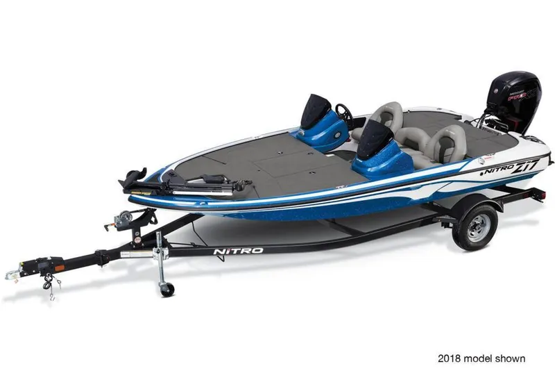 Slide: The Image of 2019 Nitro Z17 boat on trailer, blue and white design, side view. - 6