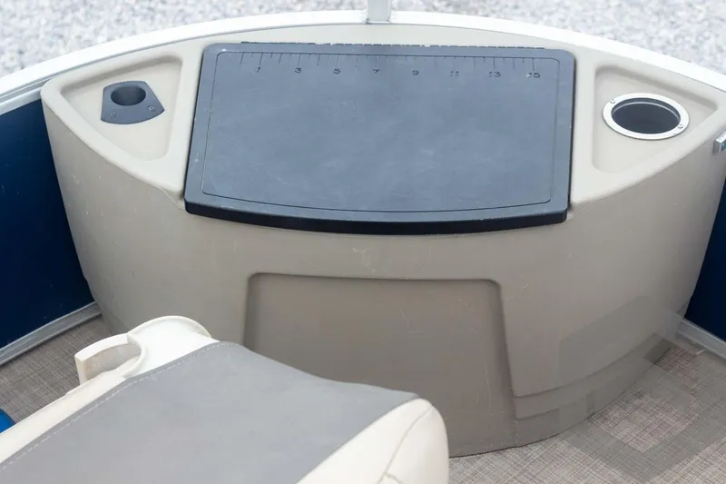 Slide: The Image of 2020 Sun Tracker Fishin' Barge 22 DLX console with cup holders and storage. - 30