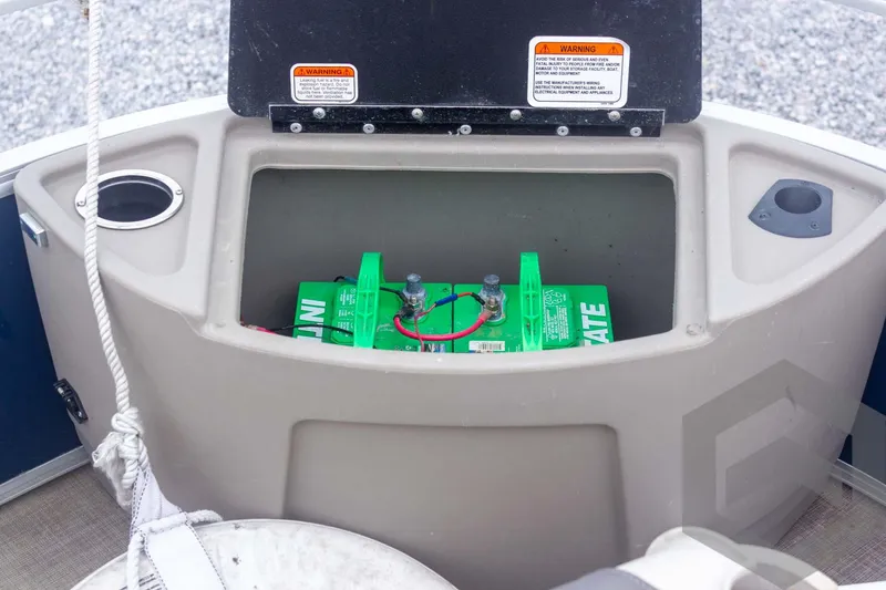 Slide: The Image of Battery compartment of 2020 Sun Tracker Fishin' Barge 22 DLX pontoon boat. - 31