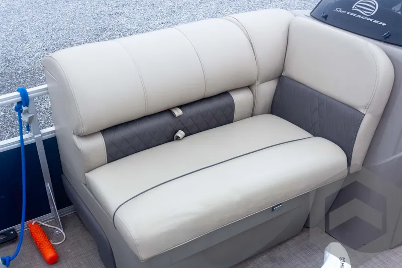 Slide: The Image of 2020 Sun Tracker Fishin' Barge 22 DLX beige seating with gray accents. - 34