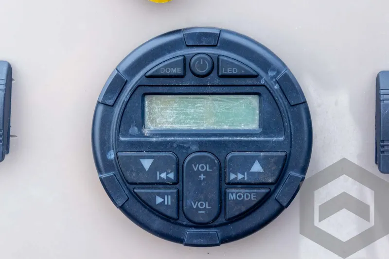 Slide: The Image of Control panel of 2020 Sun Tracker Fishin' Barge 22 DLX with volume and mode buttons. - 42