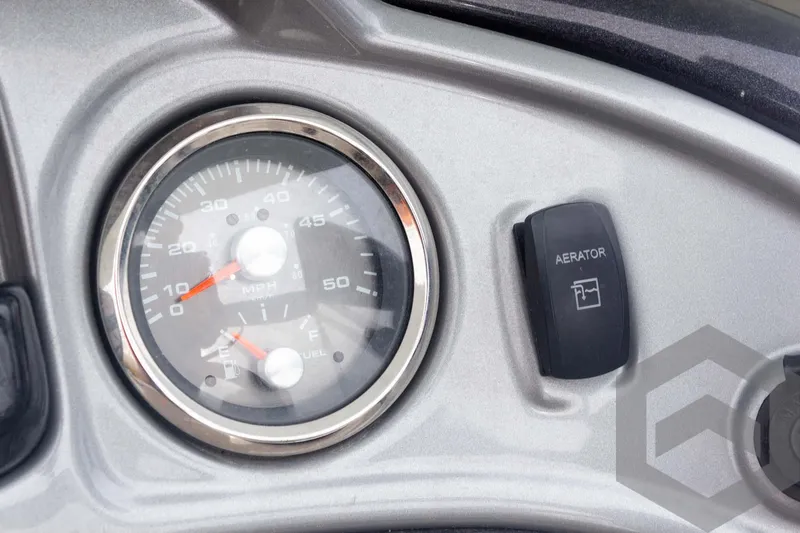 Slide: The Image of Dashboard of 2020 Sun Tracker Fishin' Barge 22 DLX with gauge and aerator switch. - 44