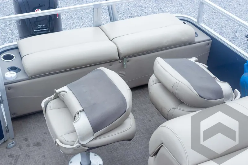 Slide: The Image of 2020 Sun Tracker Fishin' Barge 22 DLX interior with cushioned seating and fishing chairs. - 48