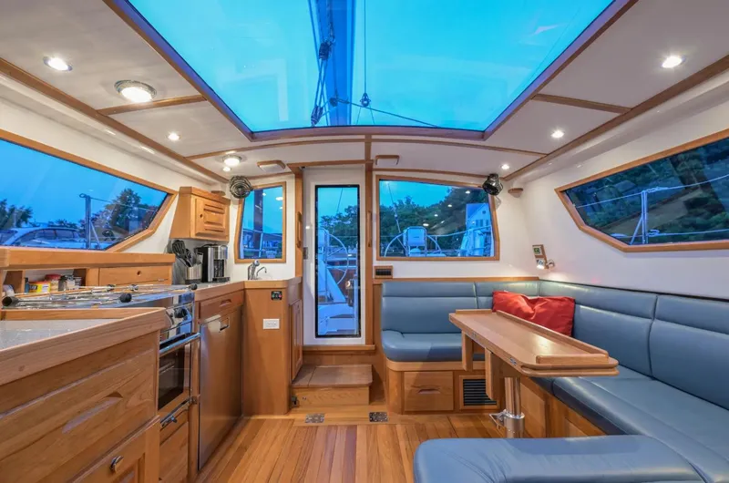 Slide: The Image of Luxurious interior of 2025 Tartan 455 yacht with modern kitchen and seating area. - 14