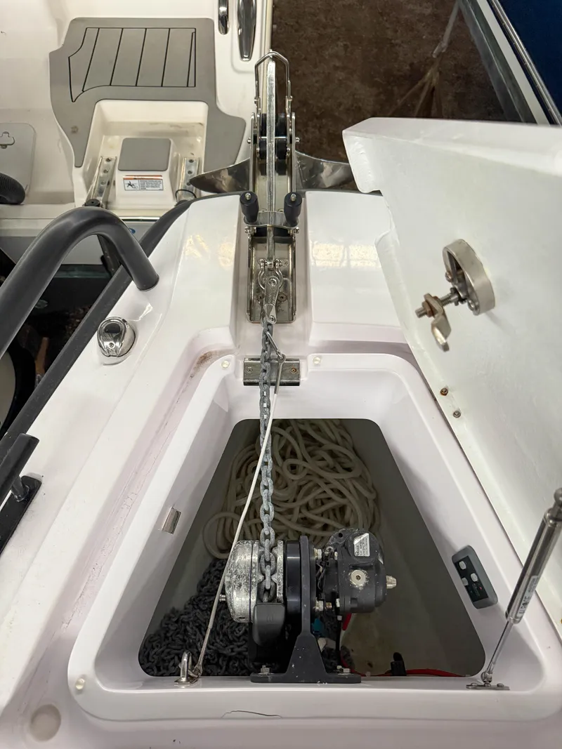 Slide: The Image of 2021 Axopar 28 CABIN anchor locker with chain and rope storage. - 16