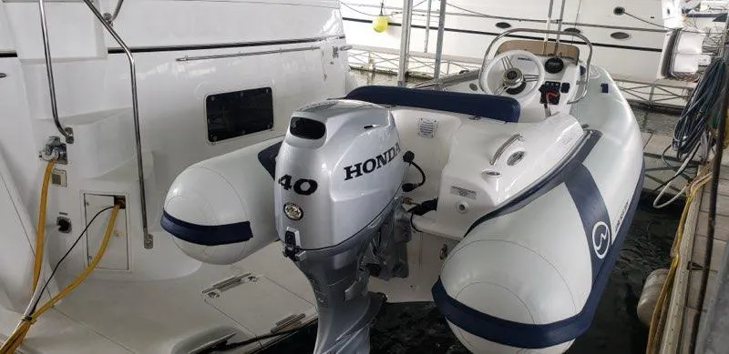 Slide: The Image of 2021 Walker Bay Generation 360 DLX with Honda 40 outboard motor docked in marina. - 13