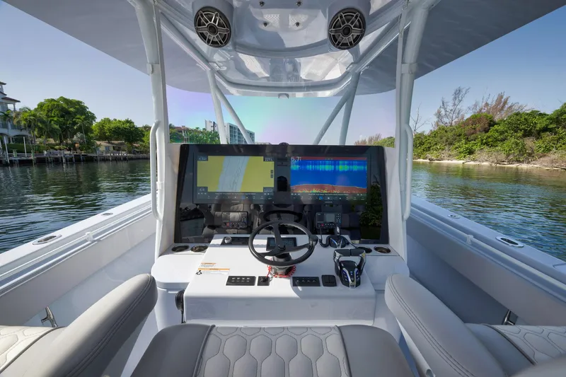 Slide: The Image of 2025 Contender 44 ST boat cockpit with advanced navigation system and comfortable seating. - 18