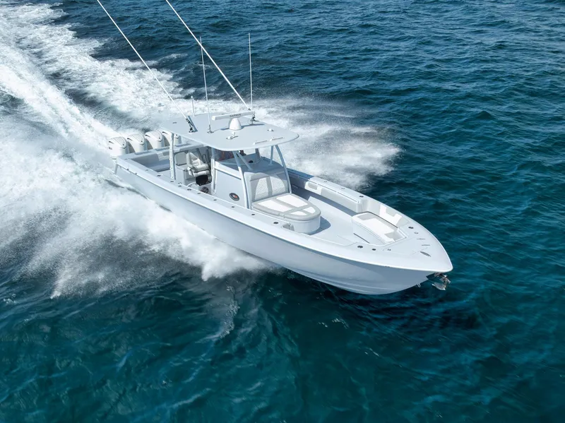 Slide: The Image of 2025 Contender 44 ST boat cruising on open ocean waters. - 2