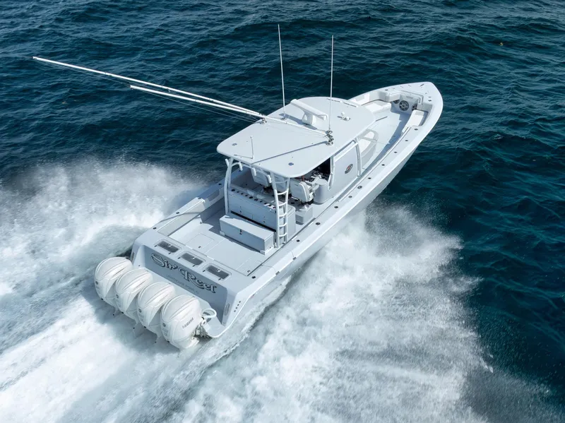 Slide: The Image of 2025 Contender 44 ST boat cruising on open water, showcasing powerful engines. - 45