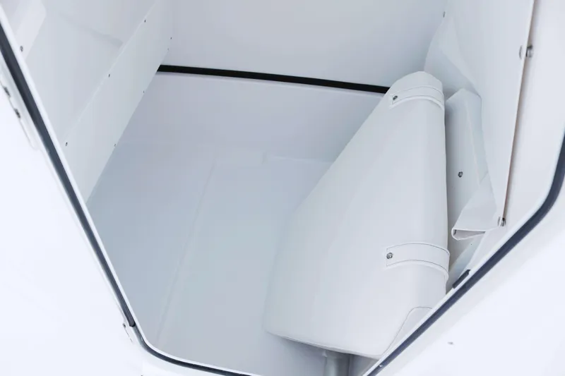 Slide: The Image of 2025 Sportsman Open 252 Center Console interior storage compartment, featuring a clean, white design. - 10