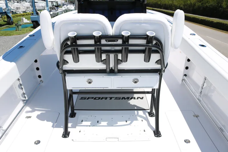 Slide: The Image of 2025 Sportsman Open 252 Center Console boat interior with seating and rod holders. - 11