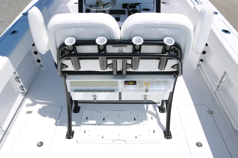 Slide: The Image of 2025 Sportsman Open 252 Center Console boat interior with rod holders and seating. - 12