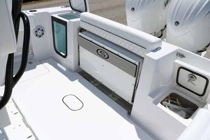 Slide: The Image of 2025 Sportsman Open 252 Center Console boat interior with seating and storage compartments. - 13