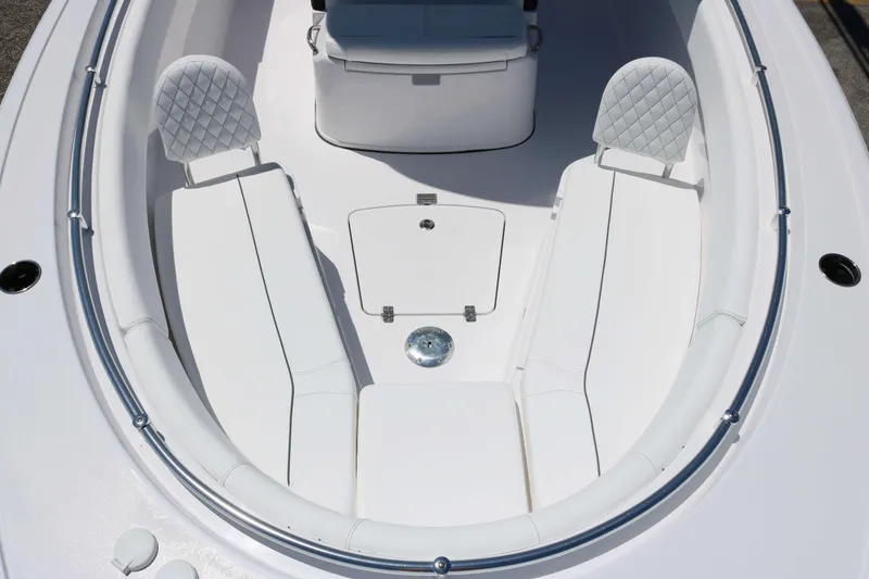 Slide: The Image of 2025 Sportsman Open 252 Center Console boat with white cushioned seating. - 9