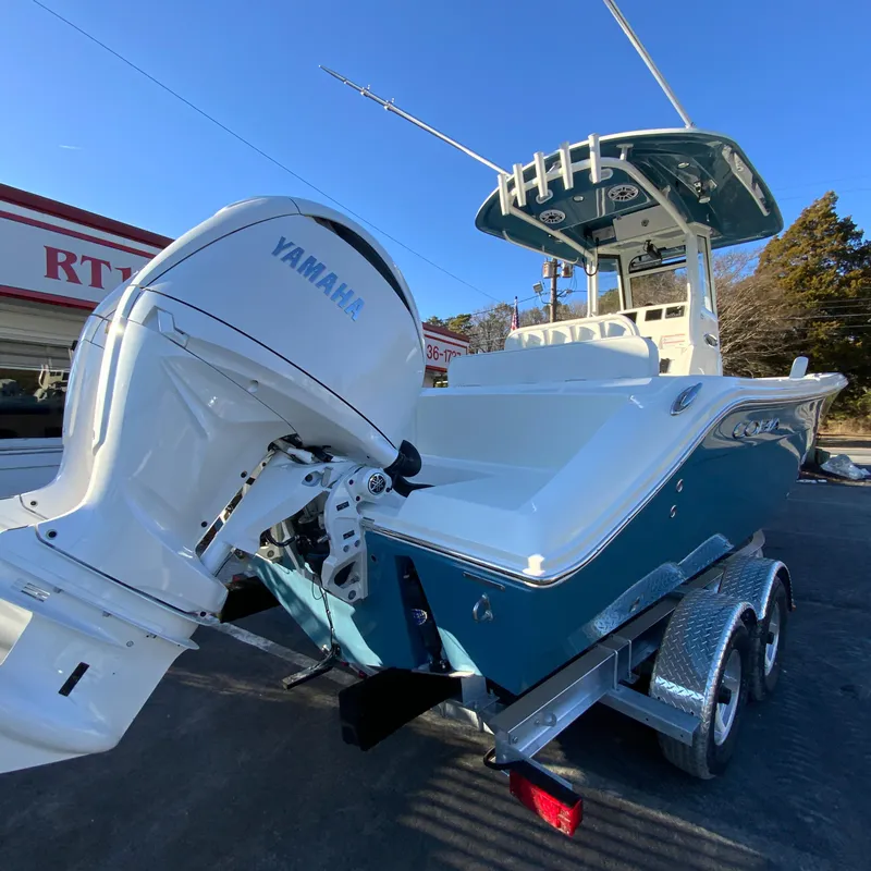 Slide: The Image of 2025 Cobia 240 Center Console boat with Yamaha engine on trailer. - 10