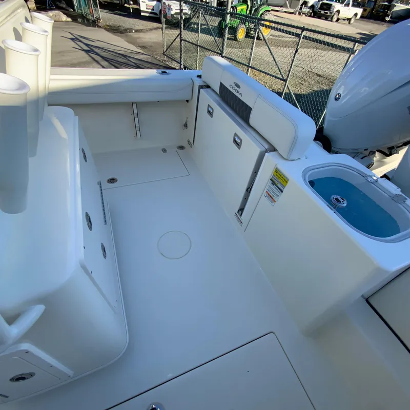 Slide: The Image of 2025 Cobia 240 Center Console boat interior with seating and storage. - 15
