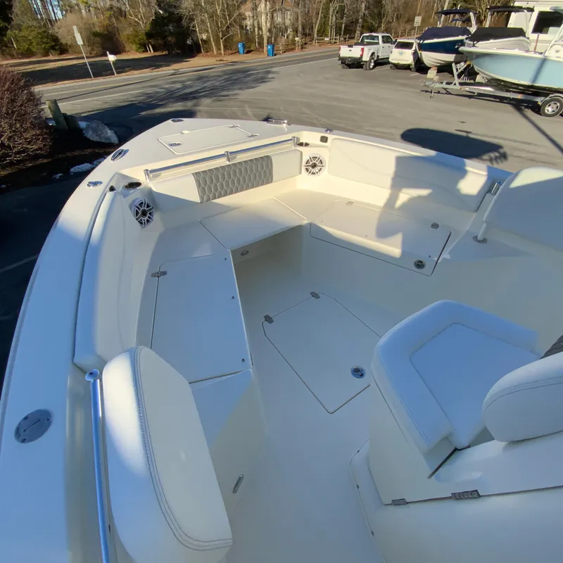 Slide: The Image of 2025 Cobia 240 Center Console boat interior with seating and storage compartments. - 19