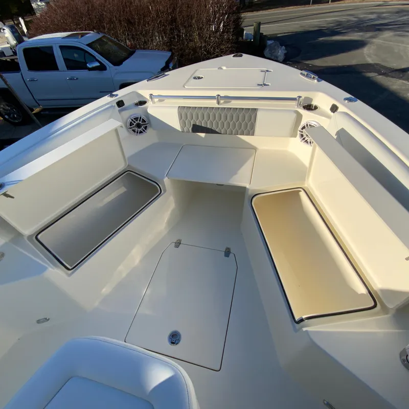 Slide: The Image of 2025 Cobia 240 Center Console boat interior with seating and storage compartments. - 20