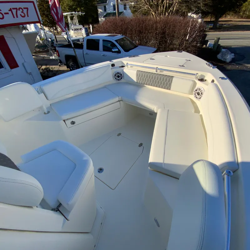 Slide: The Image of 2025 Cobia 240 Center Console boat interior with seating and storage compartments. - 22