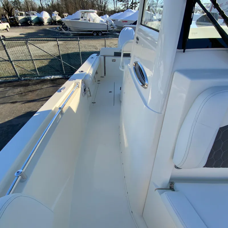 Slide: The Image of 2025 Cobia 240 Center Console boat interior, showcasing sleek design and spacious layout. - 31