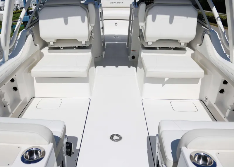 Slide: The Image of 2025 World Cat 296DC boat interior with white seating and spacious deck. - 13