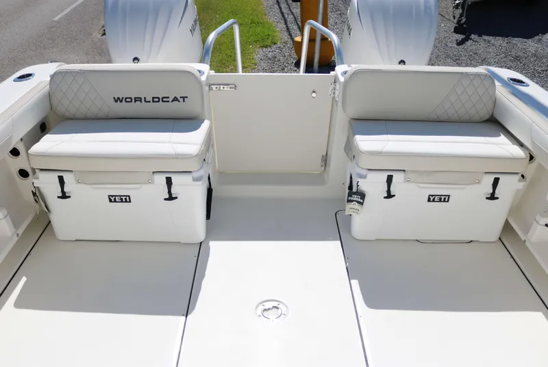 Slide: The Image of 2025 World Cat 296DC boat deck with Yeti coolers and seating. - 15