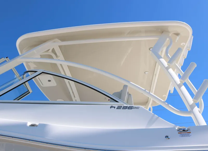Slide: The Image of 2025 World Cat 296DC boat, white exterior, viewed from below against a clear blue sky. - 5