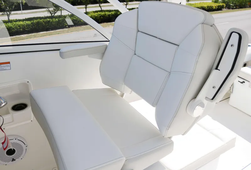 Slide: The Image of Luxury seating on 2025 World Cat 296DC boat, featuring sleek white upholstery. - 7
