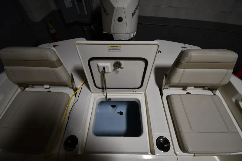 Slide: The Image of 2022 Boston Whaler 250 Dauntless boat interior with seating and storage compartment. - 30