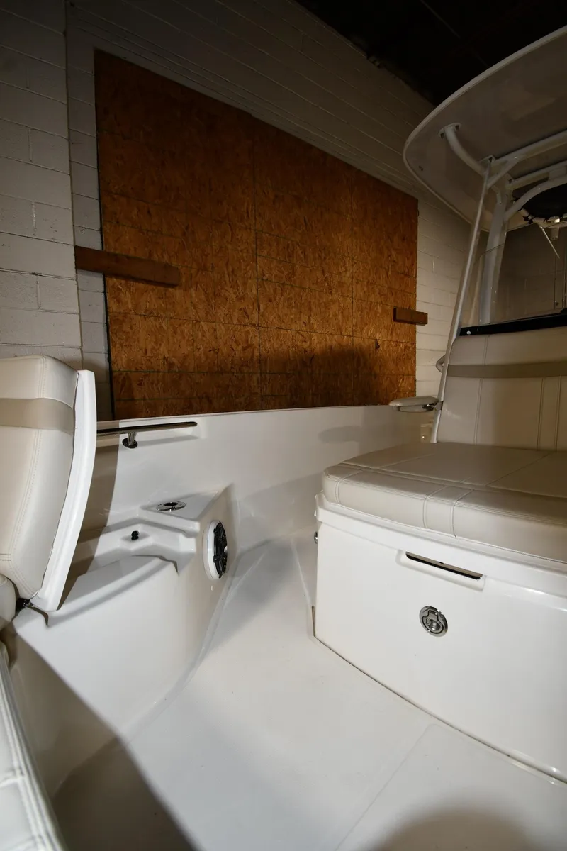 Slide: The Image of 2022 Boston Whaler 250 Dauntless interior, featuring seating and storage compartments. - 39