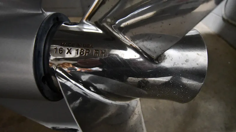 Slide: The Image of Close-up of a stainless steel boat propeller, Boston Whaler 250 Dauntless, 2022 model. - 8