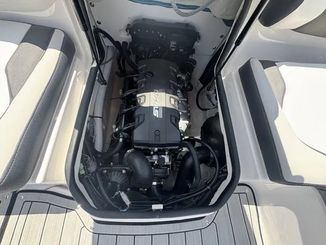 Slide: The Image of 2025 Yamaha Boats 195 S engine compartment, showcasing sleek design and advanced technology. - 10