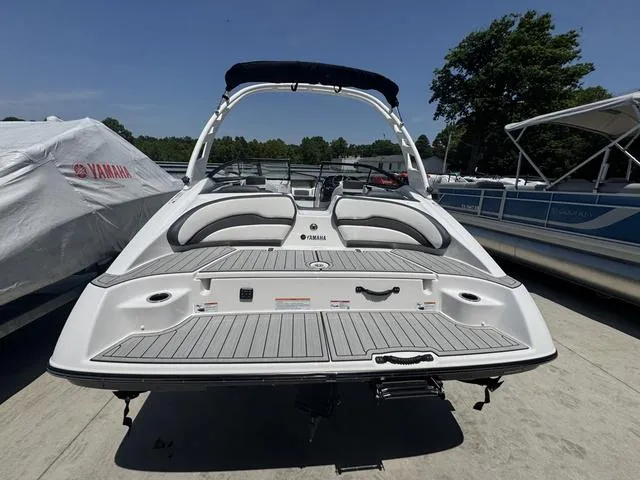 Slide: The Image of 2025 Yamaha Boats 195 S, sleek white design, side view. - 3