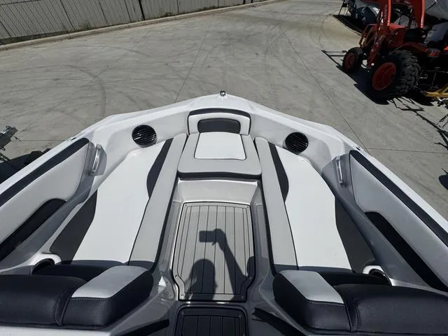 Slide: The Image of 2025 Yamaha Boats 195 S cruising on water with passengers enjoying the ride. - 7